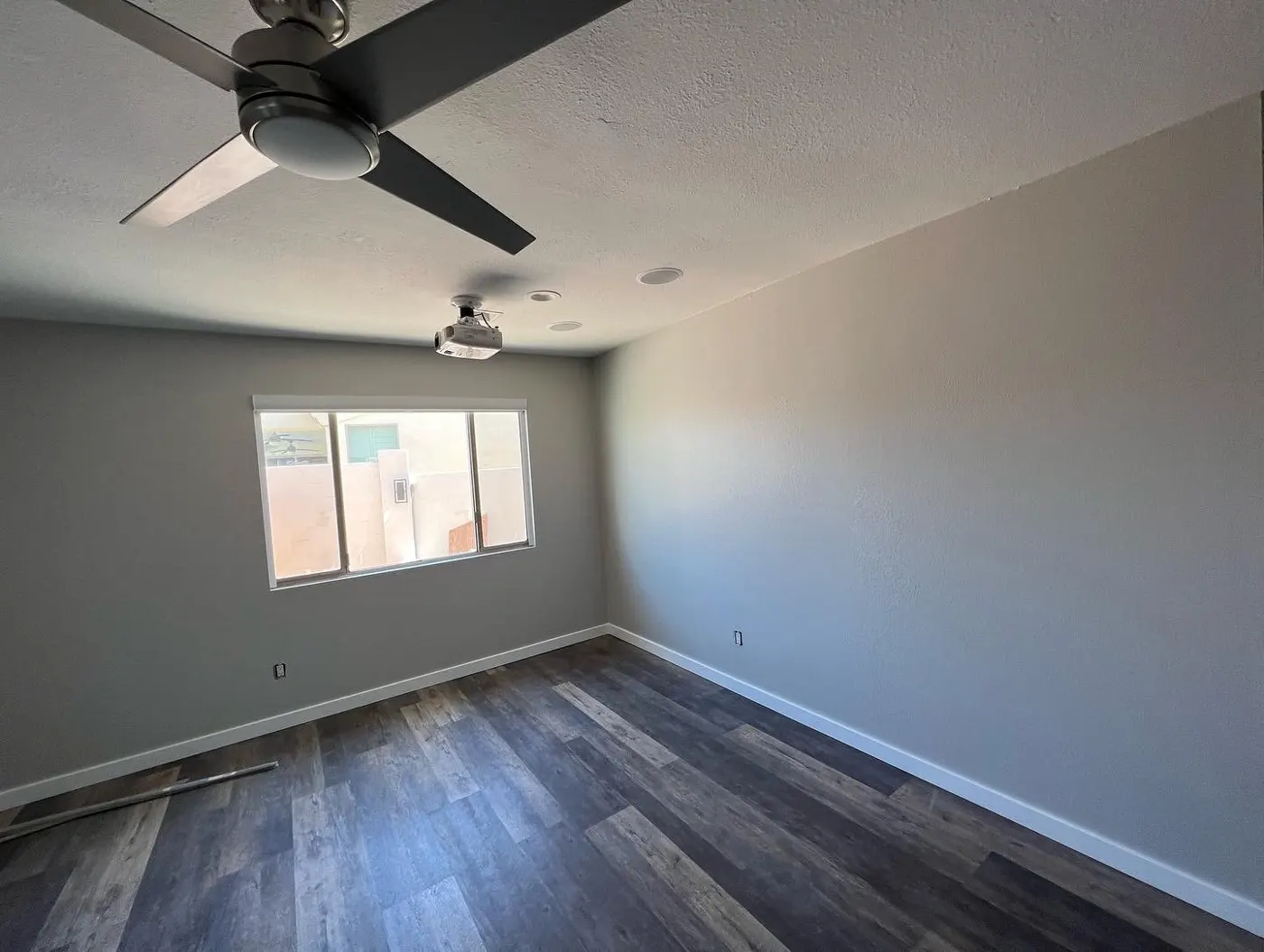 Freshly painted bedroom with ceiling fan