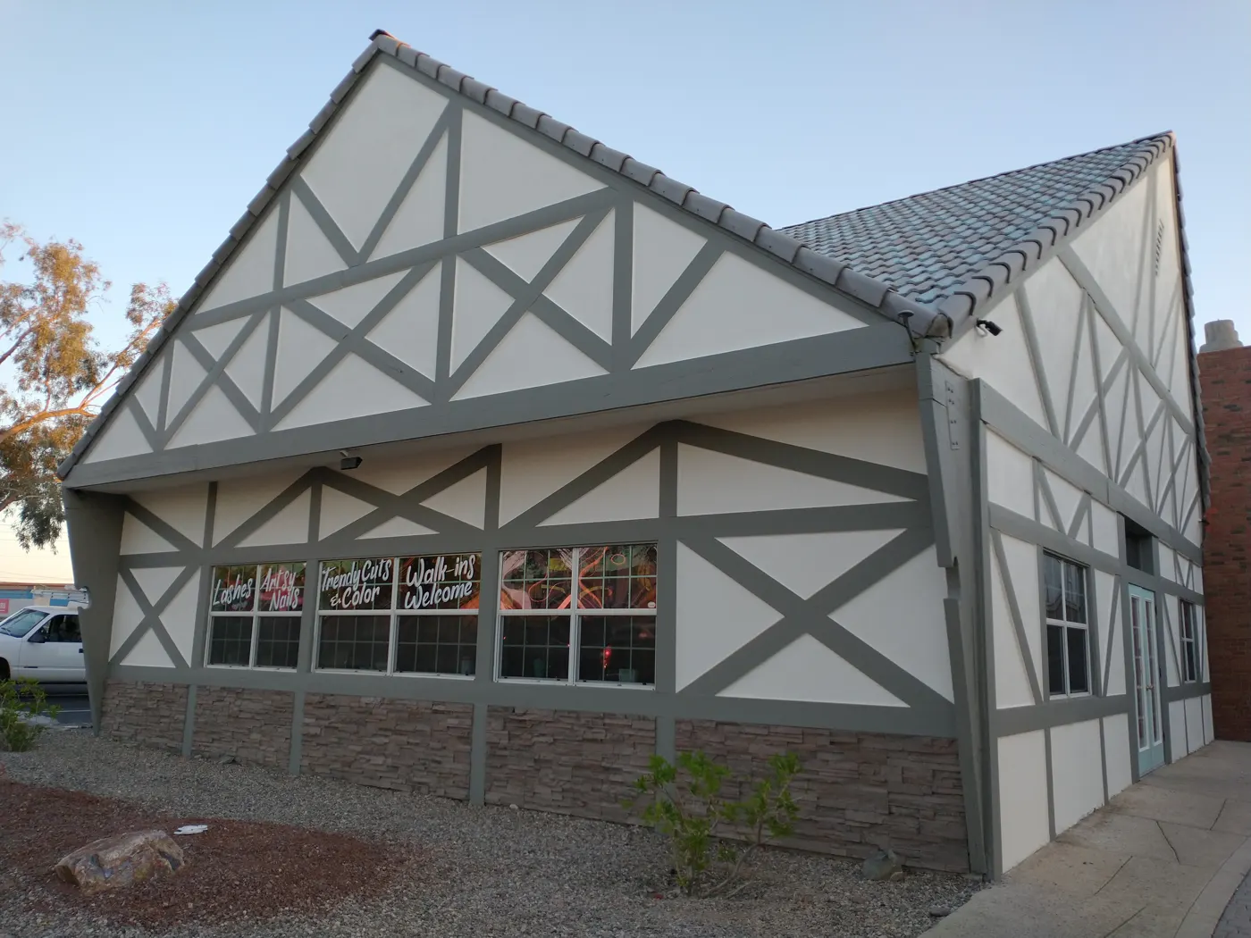 Gray and white half-timbered commercial building painted by Great Dane Painting